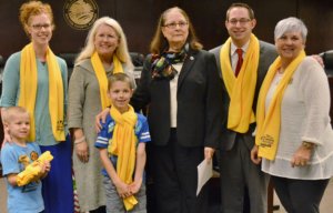 FIRST CHRISTIAN ACADEMY students and parents, along with National School Choice Week President Andrew Campanella, join Walton County Commission Chair Sara Comander and District 2 Commissioner Cecilia Jones for a photograph at the Dec. 22 Walton County Board of County Commissioners meeting. (Photo by Dotty Nist)