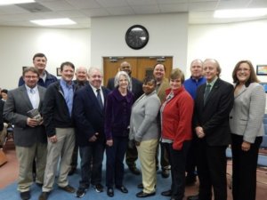 BOARD MEMBERS OF GRIT & GRACE donated Ronnie McBrayer’s new novel "Wild, Wild Walton" to area high school principals for their school library at the Jan. 5, 2016 meeting of the Walton County School Board.