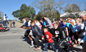 LAST WEEKEND'S CANCER FREEZE event at Lake Jackson was the biggest yet in the charity’s near-10-year history, attracting 2,000-plus visitors and raising upward of $50,000 to help support local families affected by the disease. The 5K race (starting in this photo) draws runners and walkers from all around the Southeast. This year the race had more than 500 participants – roughly a quarter of everyone in attendance. (Photo by Klariz Tucker)