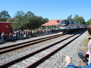 AMTRAK'S SPECIAL TRAIN passed through DeFuniak Springs, to be greeted by a throng of hopeful future passengers. (Photo by JEFFREY POWELL)