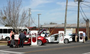 THREE TESLA MODEL S CAR OWNERS CAME out to Asset Mapping Day on Tuesday, March 8, to demonstrate for state and federal economic development officials how the supercharging station positively impacts the DeFuniak Springs economy. Tesla owners regularly enjoy lunch or dinner at a nearby downtown restaurant while waiting for their batteries to recharge, for instance. (Photo by Reid Tucker)