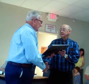 LONGTIME TOWN COUNCIL CHAIRMAN BOBBY KEMP received a plaque in honor of his many years of service to the city of Paxton. The newly renovated Town Hall was renamed the Bobby J. Kemp Town Hall Building in his honor. (Photo by Reid Tucker)