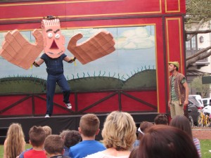 THE GIANT and Jack debate the "real" story of the beanstalk. The REP at Seaside is currently performing "The Stinky Cheese Man," a compendium of "fairly stupid" variations on classic children's fairy tales, at Rosemary Beach. (Photo by Bruce Collier)