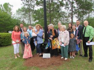 MARIE LATHINGHOUSE AND HER FAMILY gathered for the unveiling of the light and marker. Lathinghouse was honored as a Woman of Light April 15 by the DFS Woman's Club. (Photo by Bruce Collier)