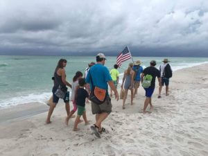 THE GROUP of Stand Your Sand walkers set off, heading west from Camp Helen. (Photo courtesy of Lynn Nesmith).