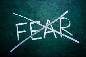 No fear concept, word on grungy blackboard