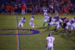 FREEPORT QUARTERBACK ZACK JOHNSON fires off a pass to Chris Decker(7) during the Bulldogs game with Cottondale last week. Decker, a senior, had a phenomenal night as he rushed for 66 yards on offense with two touchdowns while adding 2 1/2 quarterback sacks and two more rushing tackles for a loss in the contest. (Photo by Patrick Casey)