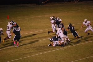 WALTON QUARTERBACK THOMAS BRACK (1) , second from right, threw for 164 yards and scored nine points (two field goals and three extra points) as the Braves beat Marianna for the third season in a row with a 27-20 win on Friday night at Everette Yates Memorial Stadium. (Photo by Jennifer Casey)