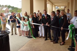 LOCAL DIGNITARIES, including the entire Freeport City Council, joined hundreds of customers to attend a ribbon cutting ceremony at the new Publix store in Freeport, on Wednesday morning, September 14. "We are extremely excited to be opening this new 45,000 foot store," said Publix Media and Community Relations Manager Dwaine Stevens. "I believe people will feel the wow factor as they enter the store today. We are offering superb service and great products. We are looking forward to fulfilling your needs and demands." Just before the ribbon was cut Freeport Mayor Russ Barley addressed the gathering. "How exciting is this?" Barley said enthusiastically. (Photo by Jeffrey Powell)