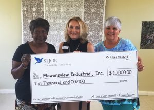 PRESENTATION OF GRANT CHECK- Pictured here (l-r) are Flowersview Industrial Community President Leatha Wright, Janet Greeno and Commissioner Cecilia Jones with a check for $10,000 from St. Joe Community Foundation.  