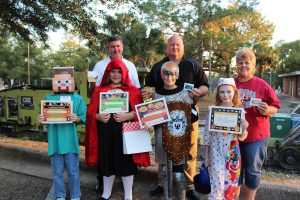 DBPA Halloween Happening Winners (ages 8-10) (l-r), front, Zane Reef McCard-Honorable Mention, Lilliana Hernandez-3rd Place, Trapper Ramsey-2nd Place, Abbigail Fields-1st Place, (L to R, back) Bobby Martin (Walton County Fire Chief), Tilman Mears (Interim City Manager), Janie Griffith (DFS Council). Photo by Cathy Mosley
