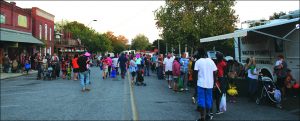 A BIG CROWD of families and Trick or Treaters gathered Halloween Night on Baldwin Avenue and around the lake in DeFuniak Springs for candy and costume contests. 